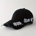 Black distressed cap with 'Never Give Up' text on a white background
