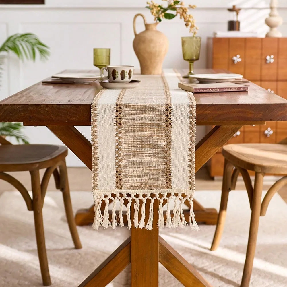 Wooden dining table with a decorative table runner in a home setting