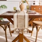 Wooden dining table with a decorative table runner in a home setting