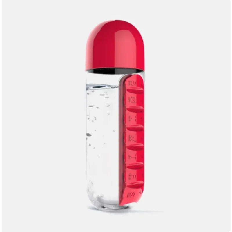 Clear water bottle with red cap and red pill holder on a white background