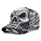 A baseball cap featuring a detailed black and white skull and wing graphic print, shown on a clean white background.