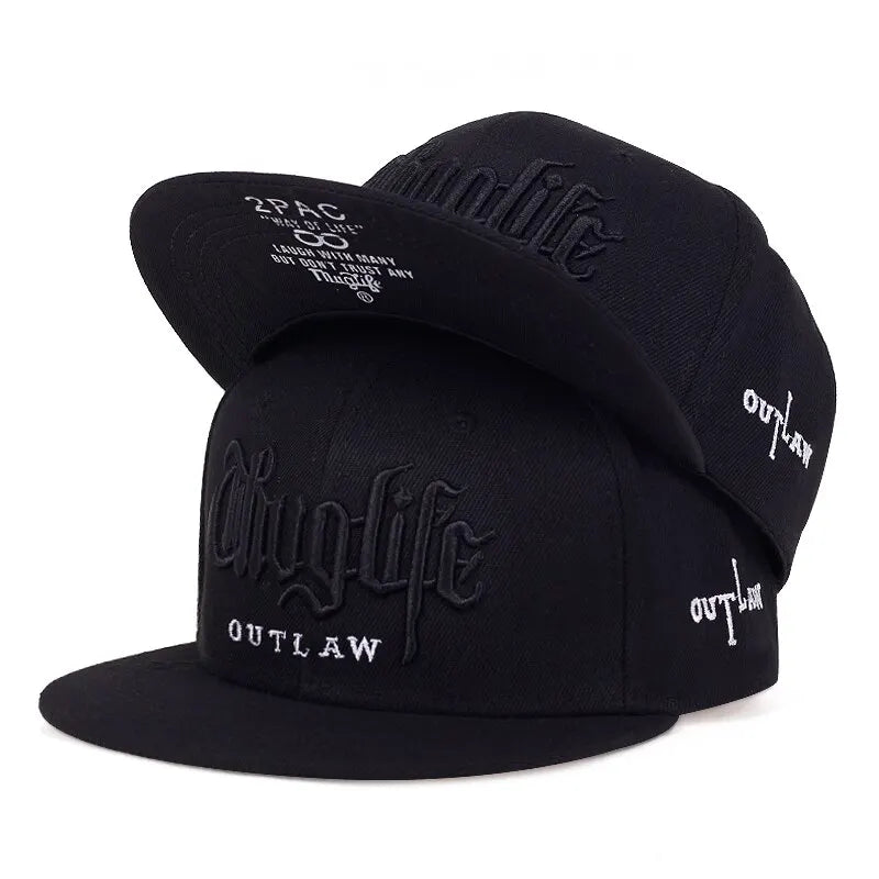 Black cap with 'Thug Life' and 'Outlaw' text on a white background