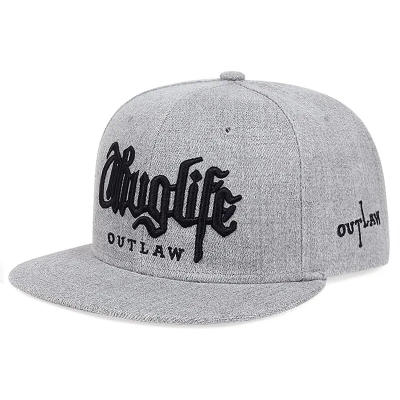 Gray cap with 'Thug Life Outlaw' text on a white background