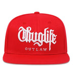 Red cap with white 'Thuglife Outlaw' text on a white background