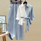 Light blue denim skirt and matching shirt on hangers against a beige background