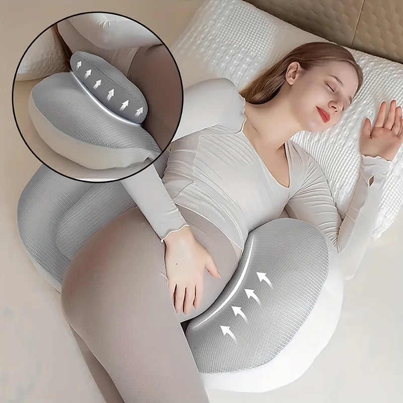 Woman using a U-shaped body pillow with a close-up of the pillow's design.