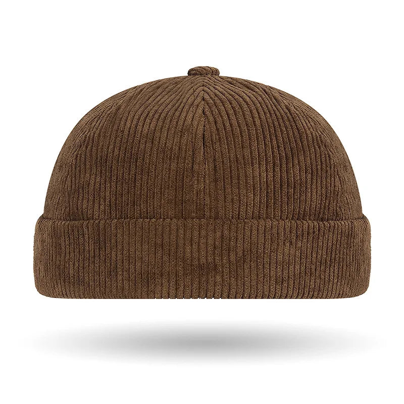 Brown ribbed brimless baseball cap on a white background