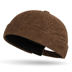 Brown brimless baseball cap tang hat on a white background