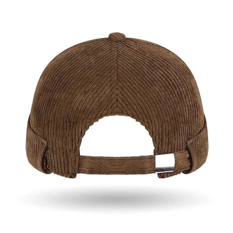 Brown ribbed brimless tang style cap on a white background