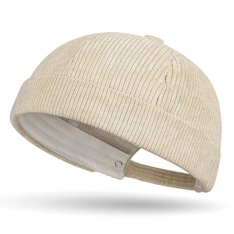 Beige brimless baseball cap on a white background