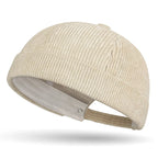Beige brimless baseball cap on a white background