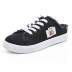 Black slide in slip on half sneakers with white laces cool stylish.