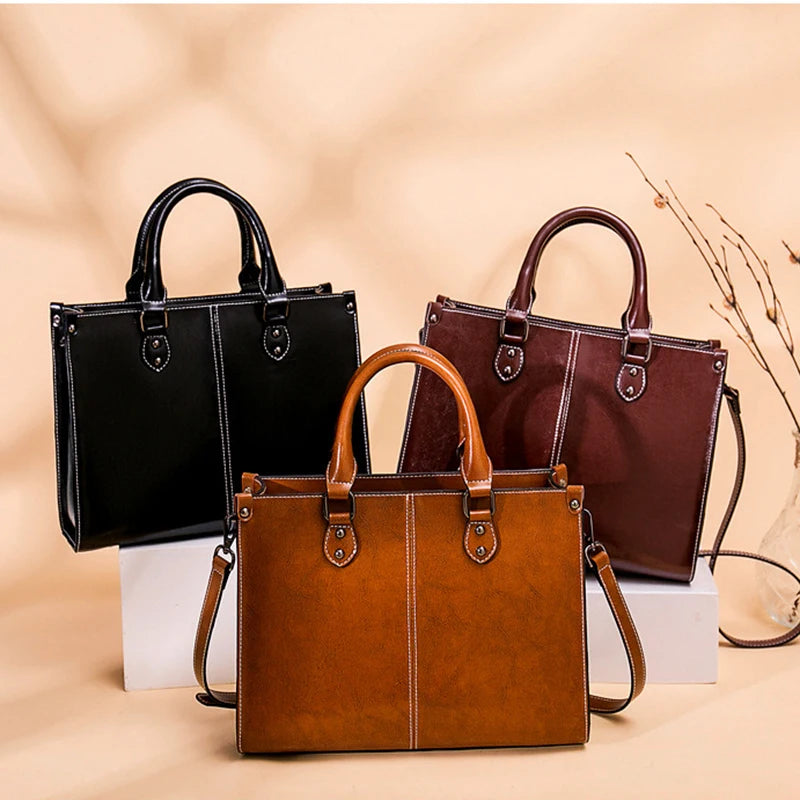 Three handbags in black, brown, and tan on a beige background