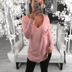 A woman in a pink long-sleeve long top stylish tee,