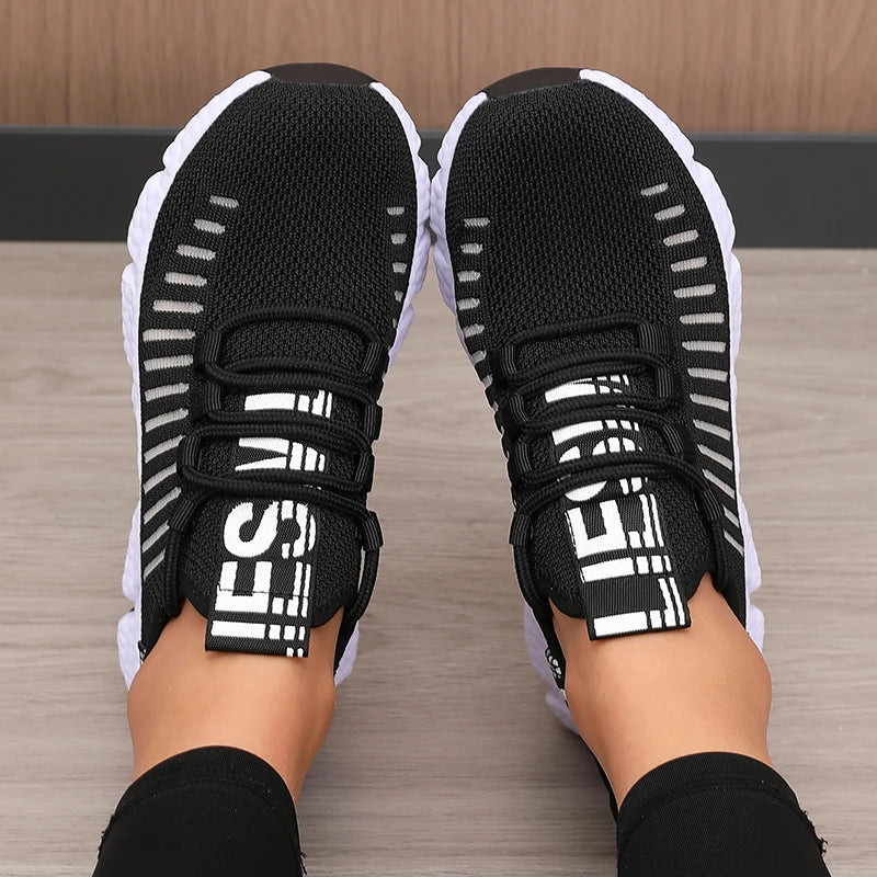 Black and white athletic women's shoes sneakers lightweight.