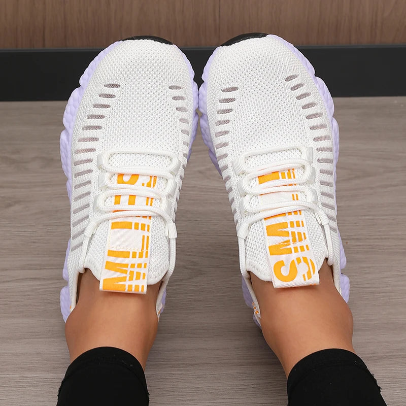 White sneakers with orange accents soft comfortable light for walking, running, casual.