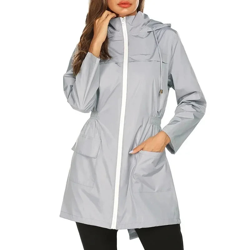 Light gray raincoat worn by a model on a white background