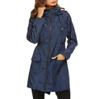 Navy blue raincoat worn by a person on a white background