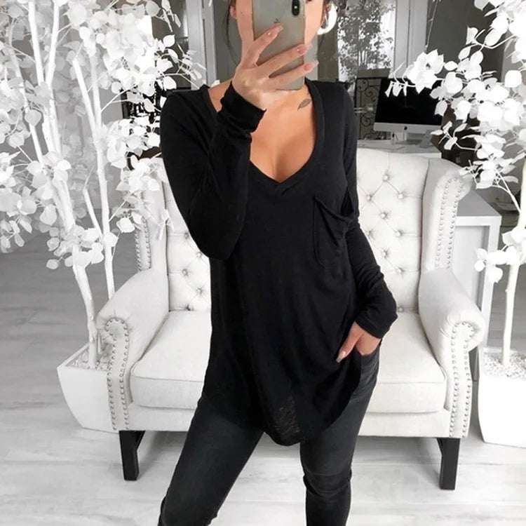 Woman in a black long-sleeve super long t-shirt casual baggy outfit.
