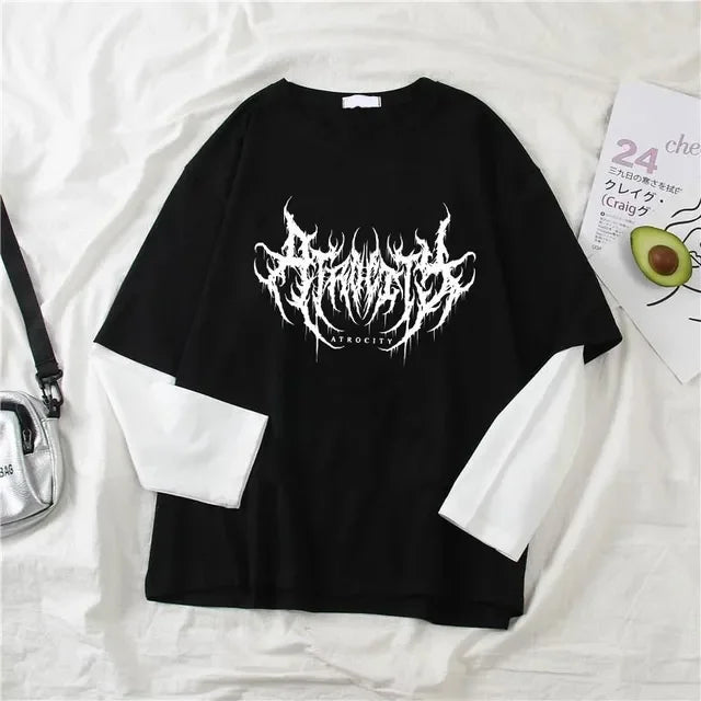 Black t-shirt with white graphic design on a white surface gothic goth atrocity art